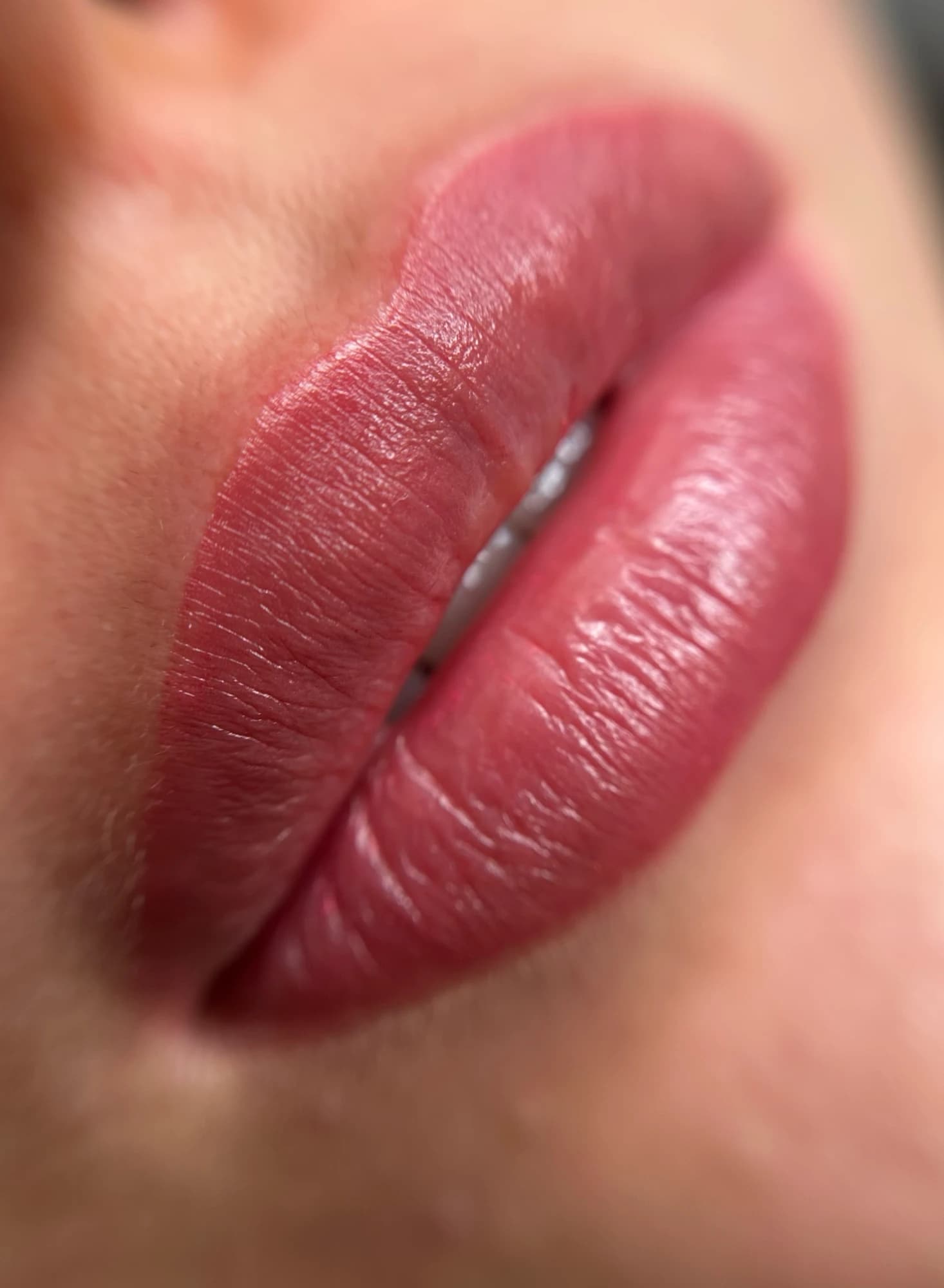 Close-up of natural lip blush result — fresh, defined lips after cosmetic tattooing by Marika